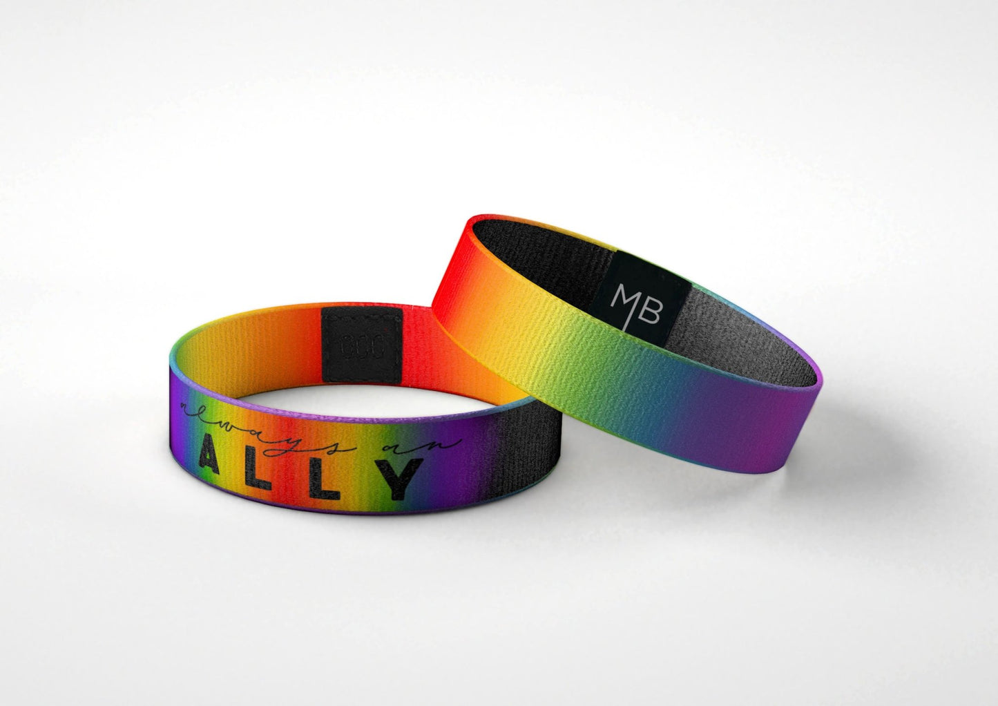 A Picture of Always an Ally inspirational wristband Moxxie Band black with a rainbow of colors supporting LGBTQ+ PRIDE laying down view